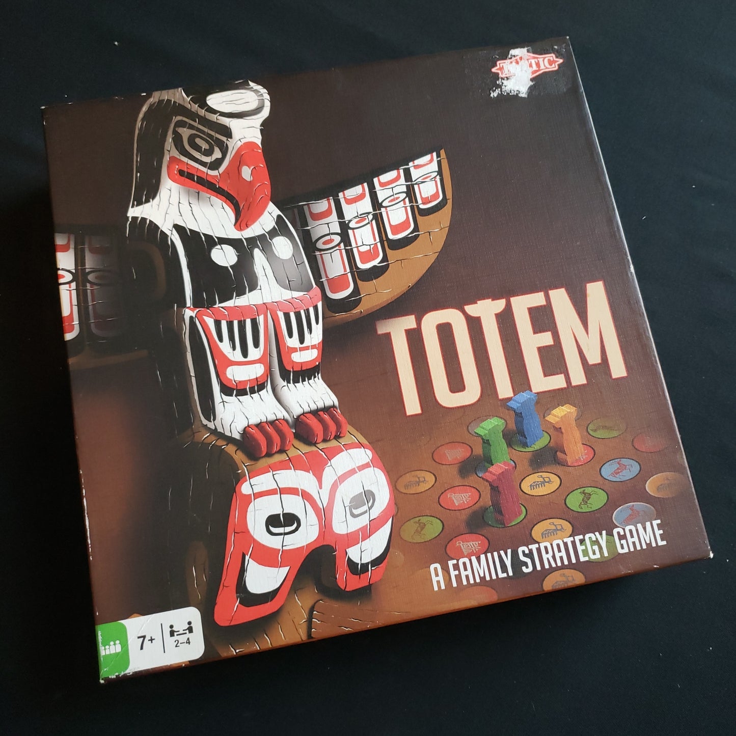 Image shows the front cover of the box of the Totem board game