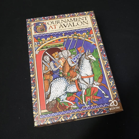 Image shows the front cover of the box of the card game Tournament At Avalon