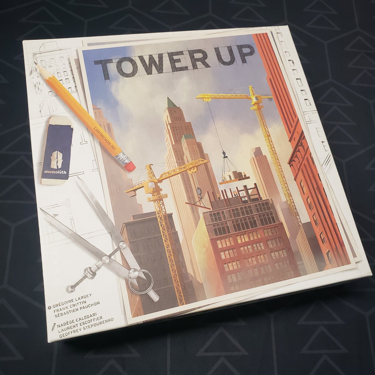 Image shows the front cover of the box for the Tower Up board game