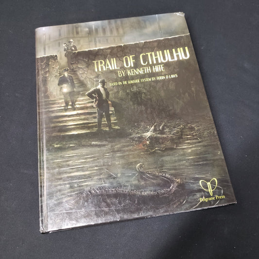 Image shows the front cover of the core rulebook for the roleplaying game Trail of Cthulhu
