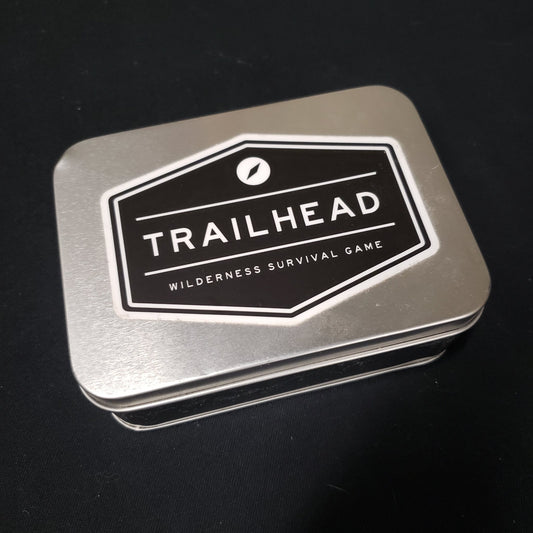 Image shows the front cover of the box of the Trailhead board game