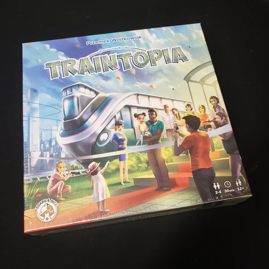 Image shows the front cover of the box of the Traintopia board game