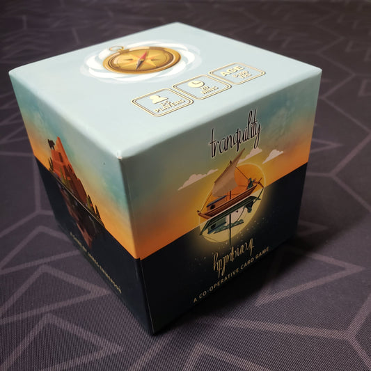 Image shows the front cover of the box of the Tranquility card game