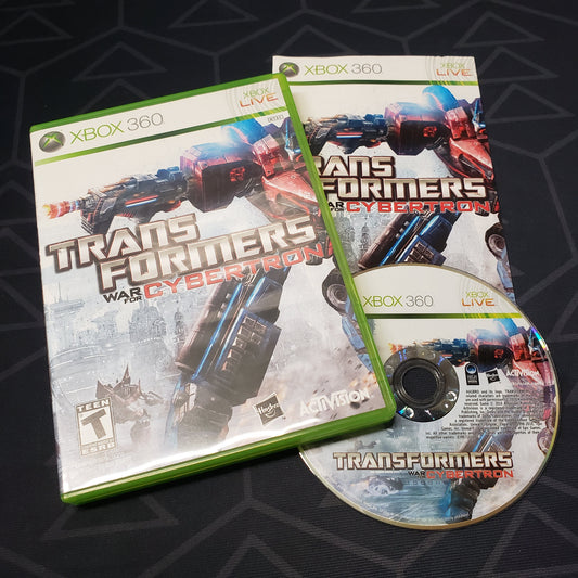 Image shows the case, manual and disc for the video game Transformers: War for Cybertron for Xbox 360
