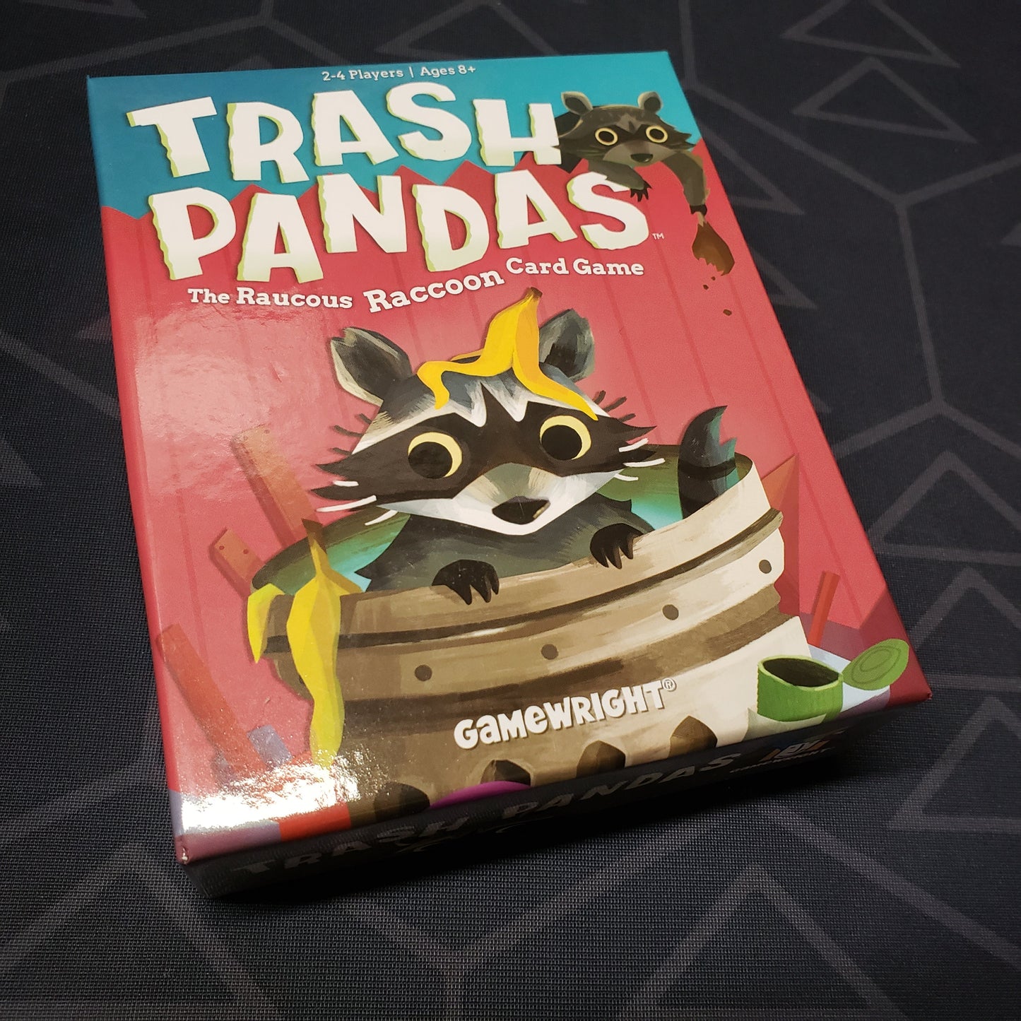 Image shows the front cover of the box for the Trash Pandas card game
