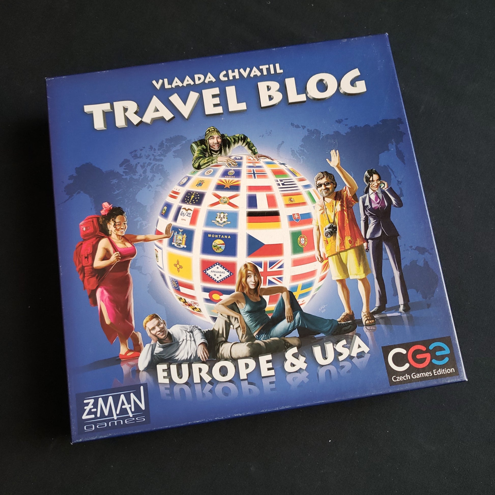 Image shows the front cover of the box of the Travel Blog board game