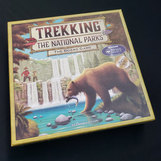 Image shows the front cover of the box of the Trekking the National Parks board game