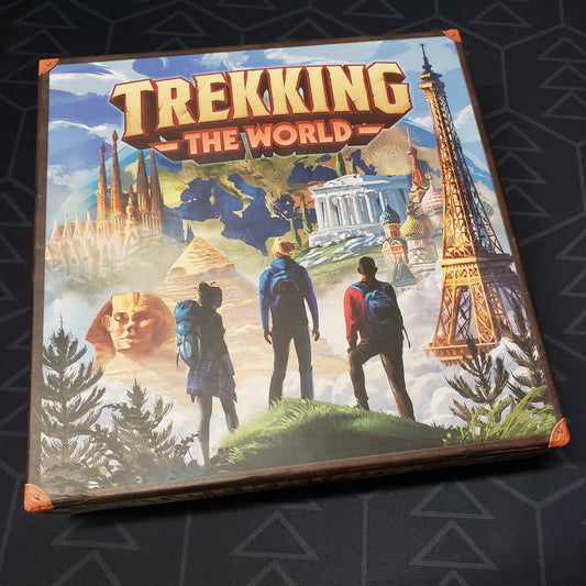 Image shows the front cover of the box for the Trekking the World (First Edition) board game