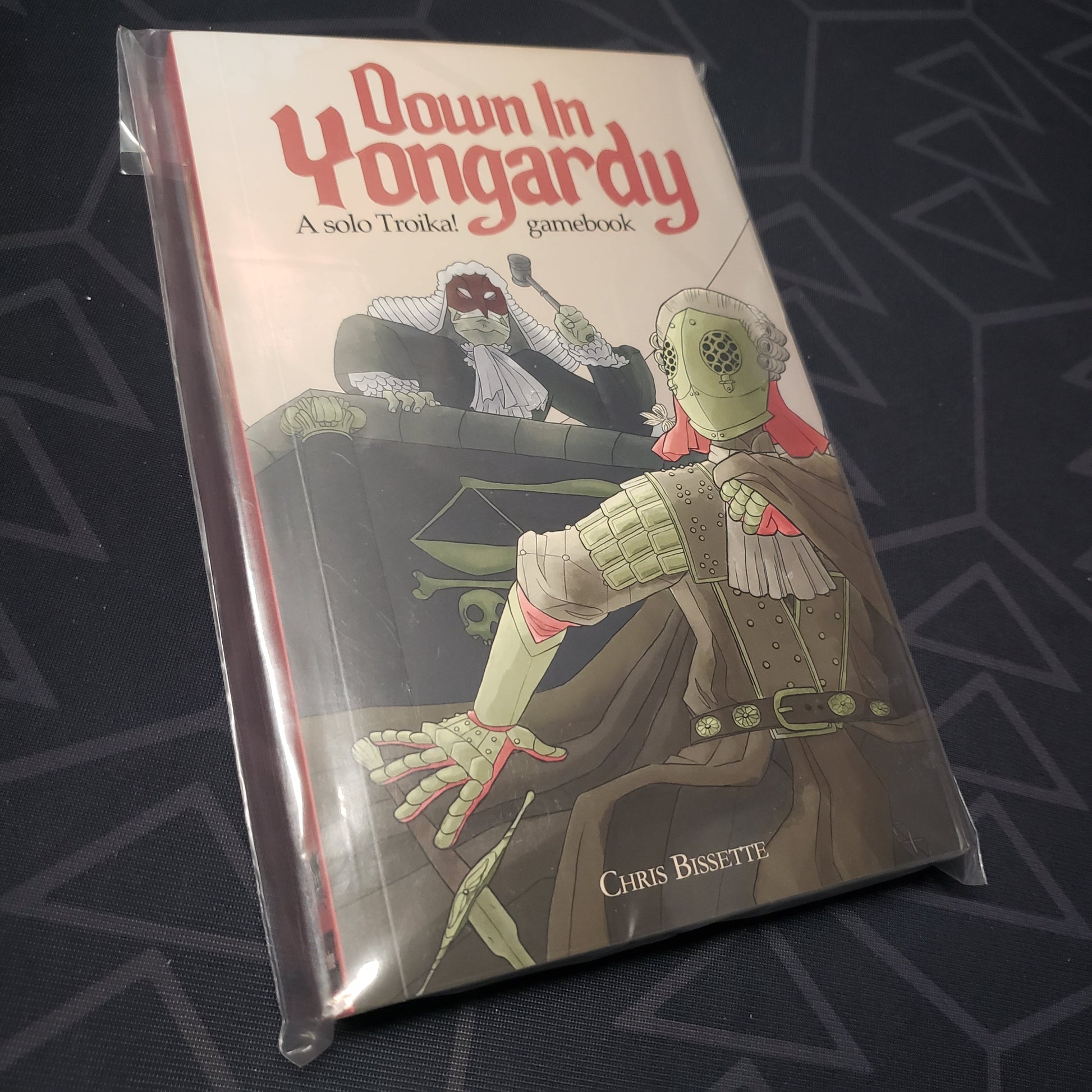 Image shows the front cover of the TROIKA!: Down in Yongardy roleplaying game book