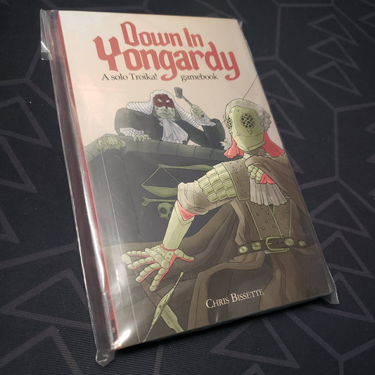 Image shows the front cover of the TROIKA!: Down in Yongardy roleplaying game book