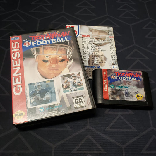 Image shows the case, poster and cartridge for the video game Troy Aikman NFL Football for Sega Genesis