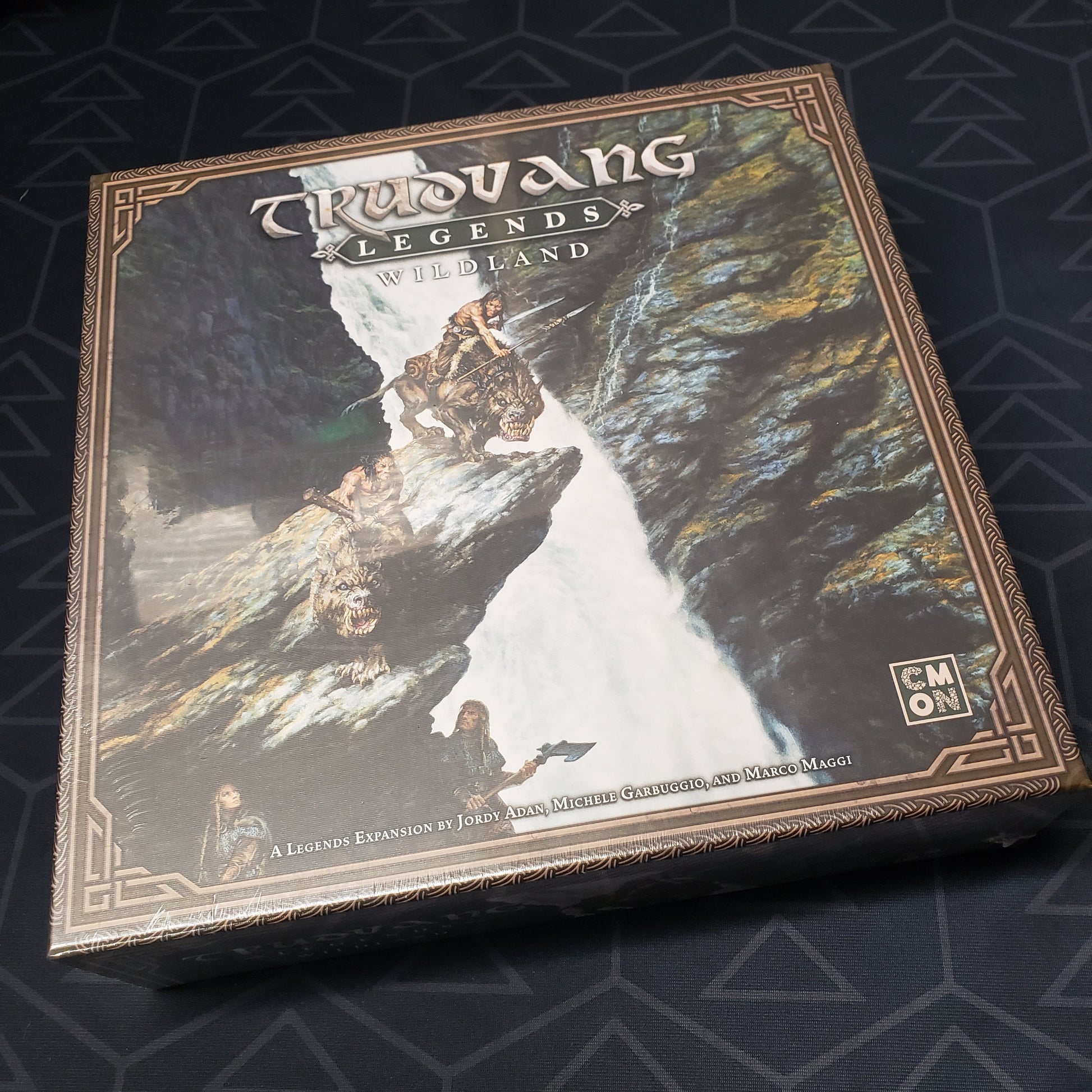 Image shows the front cover of the box of the Wildland expansion for the board game Trudvang Legends