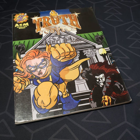 Image shows the front cover of the core rulebook for the roleplaying game Truth & Justice