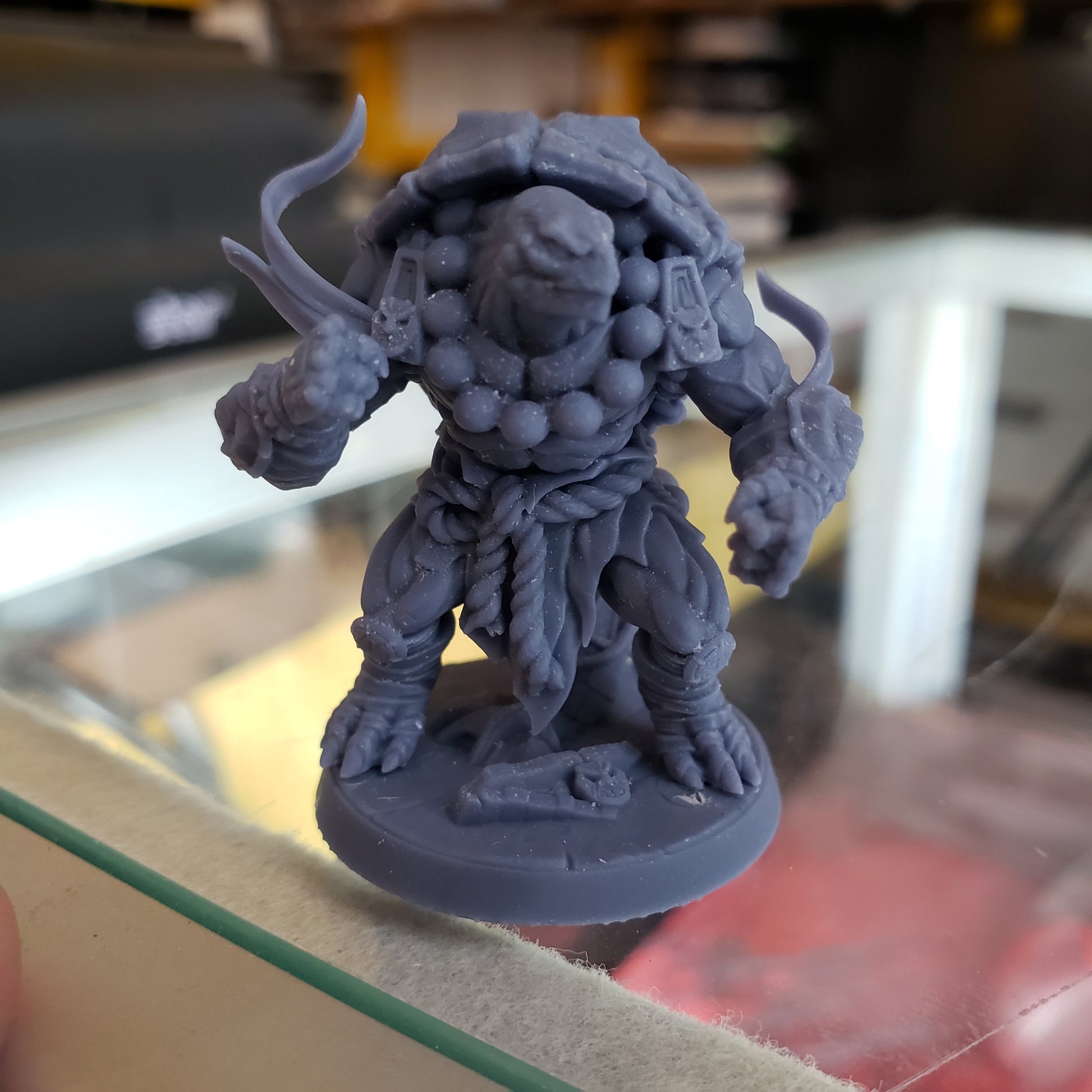 Image shows an example of a 3D printed turtle monk gaming miniature printed in-house at All Systems Go