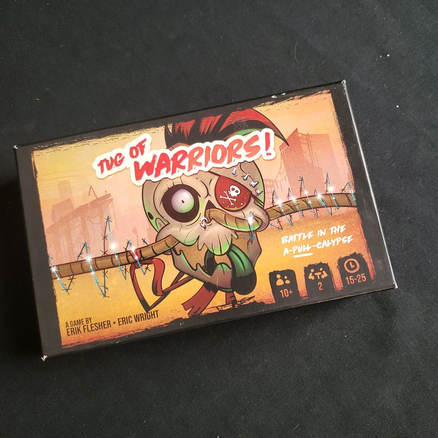 Image shows the front cover of the box of the Tug-Of-Warriors! card game