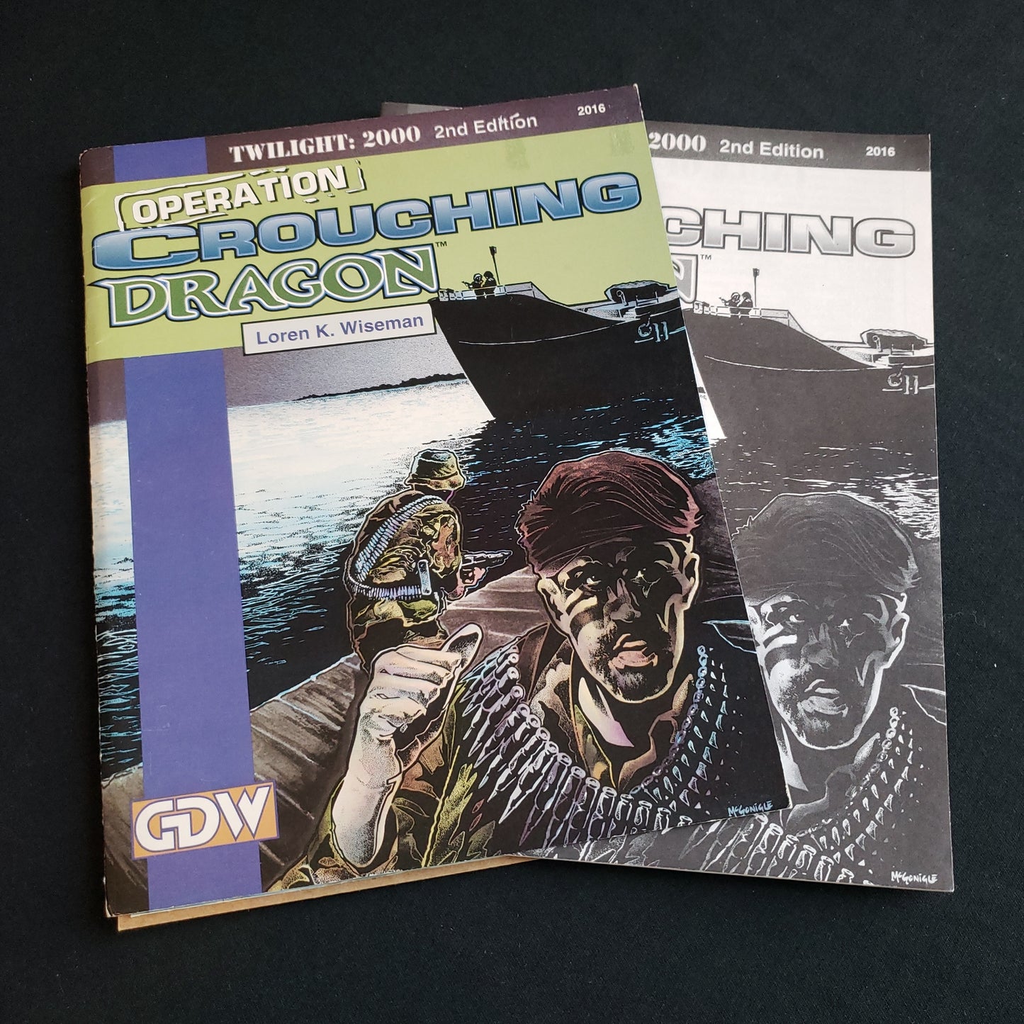 Image shows the front cover of the Operation Crouching Tiger module for the Twilight: 2000 roleplaying game, with the scenario book askew inside it