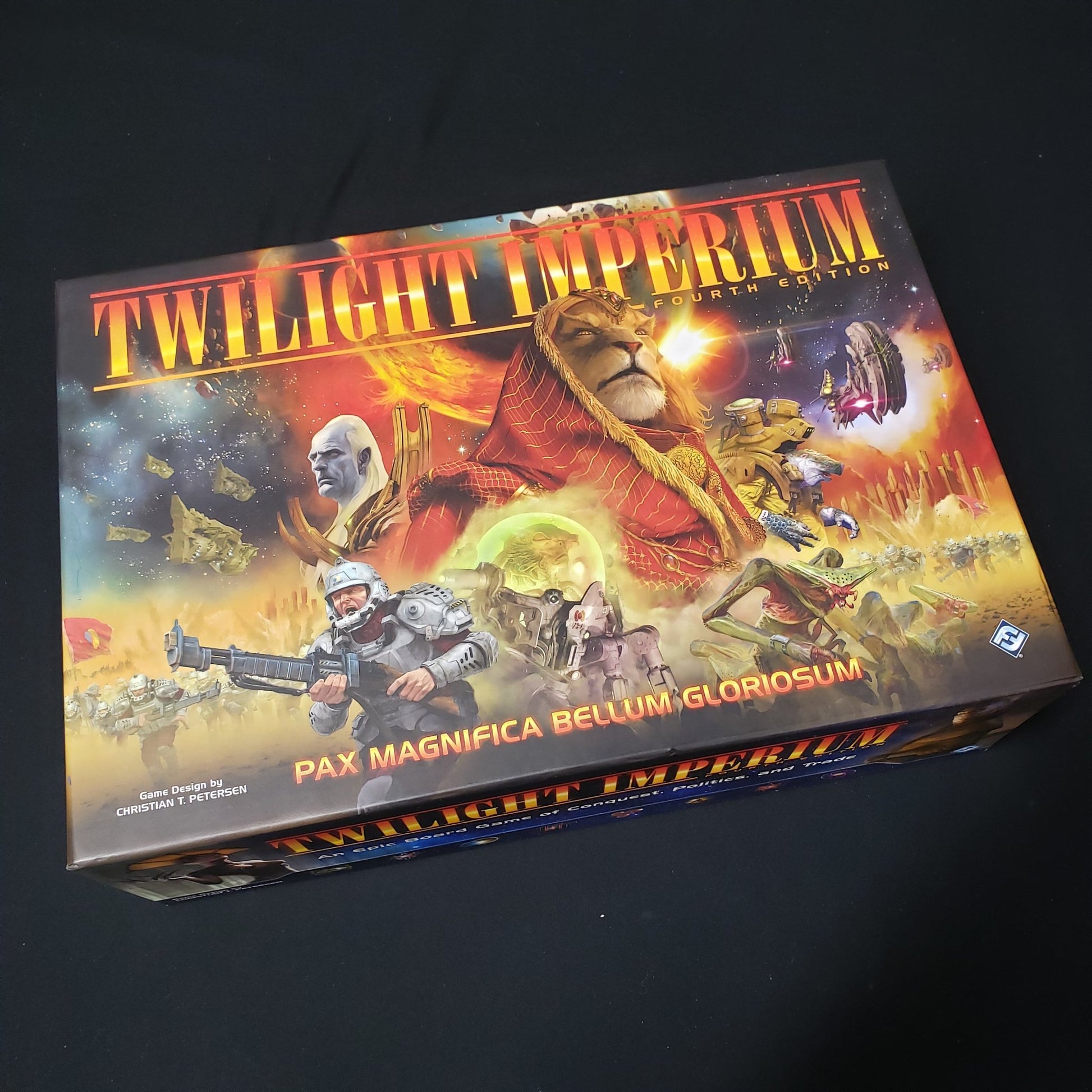 Image shows the front cover of the box of the board game Twilight Imperium (Fourth Edition)
