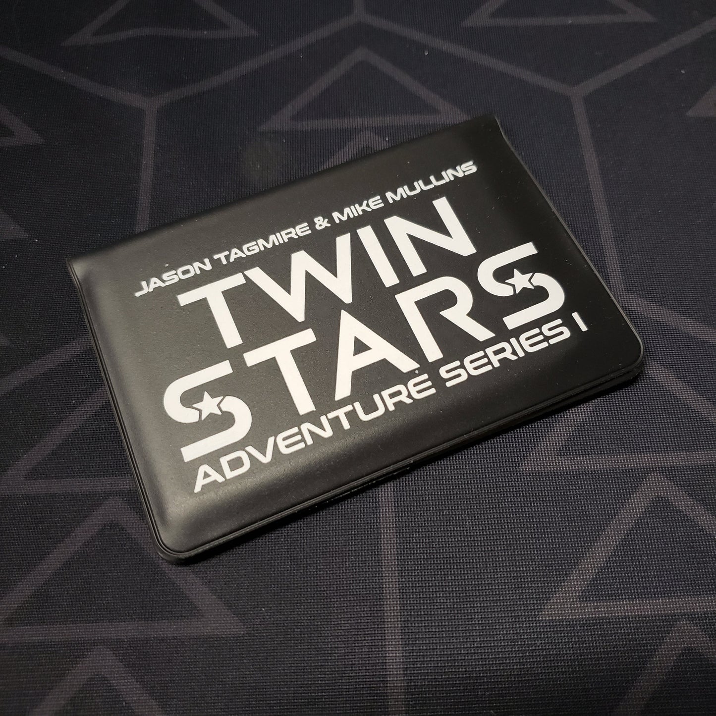 Image shows the front of the card wallet for the Twin Stars: Adventure Series I card game