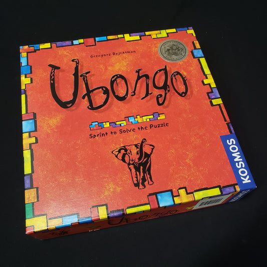 Image shows the front cover of the box of the Ubongo board game