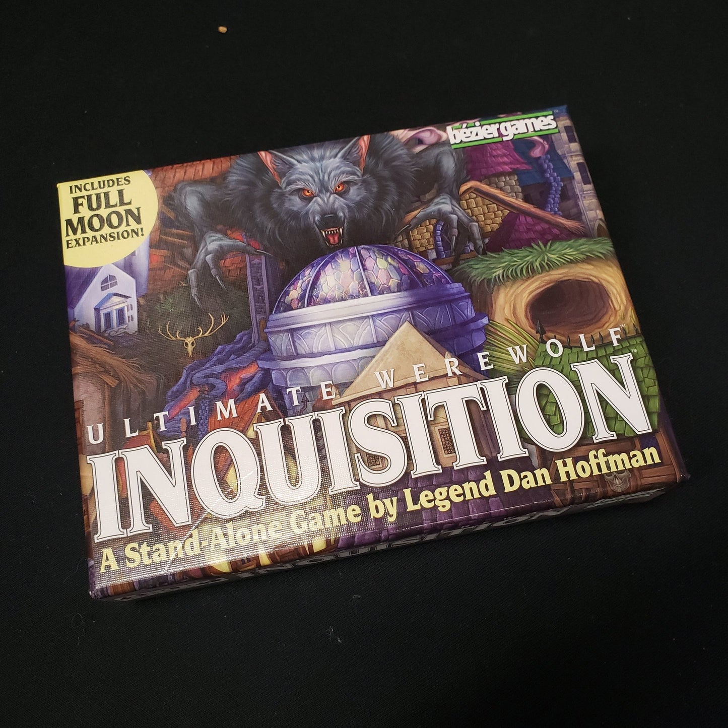 Image shows the front cover of the box of the Ultimate Werewolf:Inqusition party game