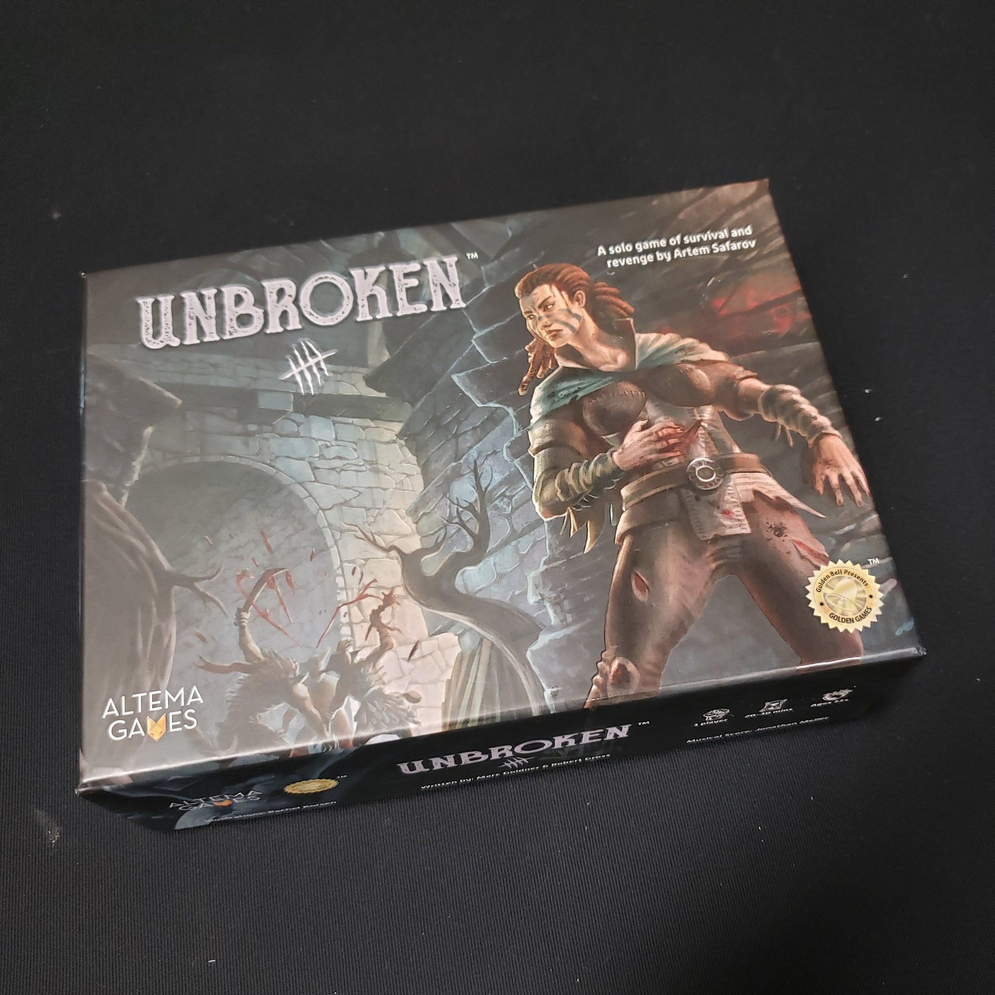 Image shows the front cover of the box of the Unbroken board game