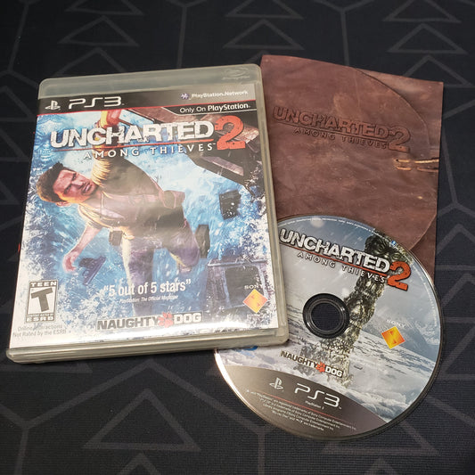 Image shows the case, manual and disc for the video game Uncharted 2: Among Thieves for Playstation 3
