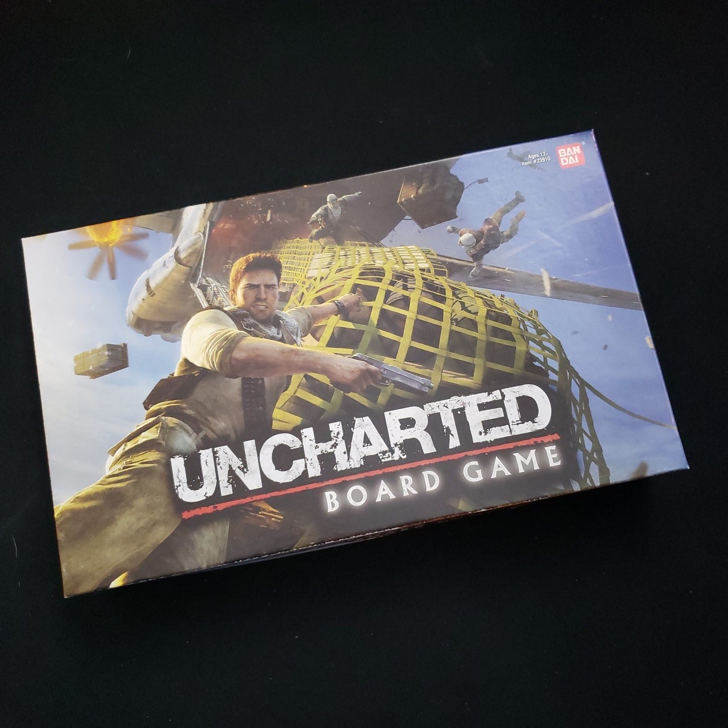 Image shows the front cover of the box of Uncharted: The Board Game