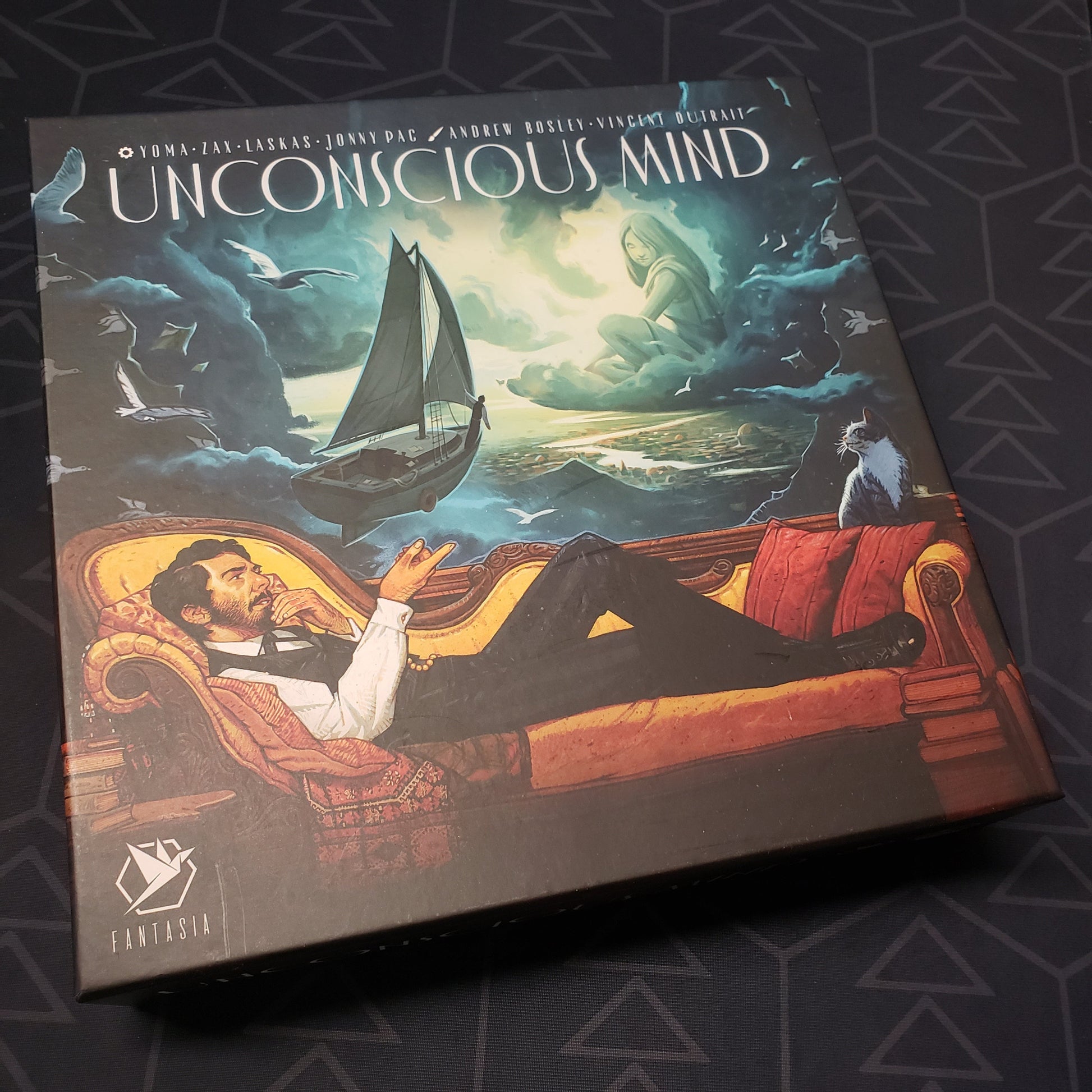 Image shows the front cover of the box for the Unconscious Mind board game