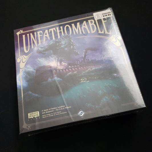 Image shows the front cover of the box of the Unfathomable board game