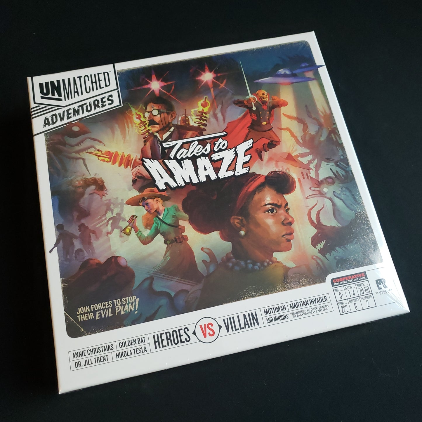 Image shows the front cover of the box of the Unmatched Adventures: Tales to Amaze board game