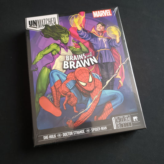 Image shows the front cover of the box of the Unmatched: Brains & Brawn board game