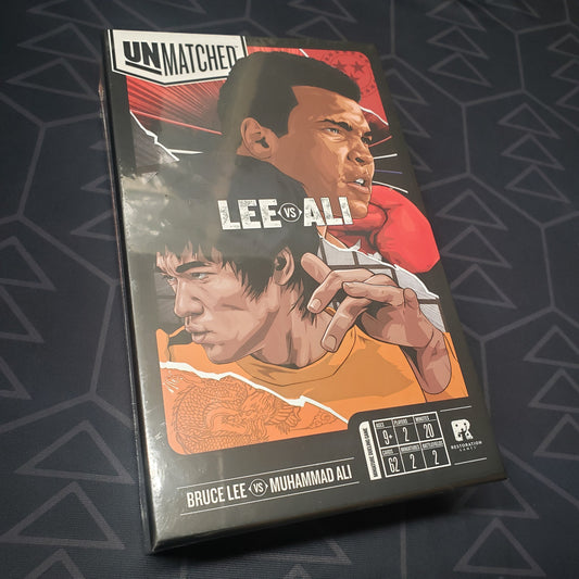 Image shows the front cover of the box for the Unmatched: Muhammad Ali vs. Bruce Lee board game