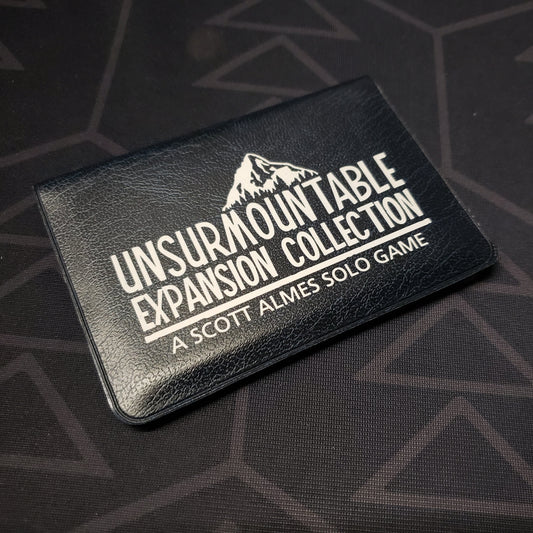 Image shows the front of the card wallet of the Expansion Collection for the card game Unsurmountable
