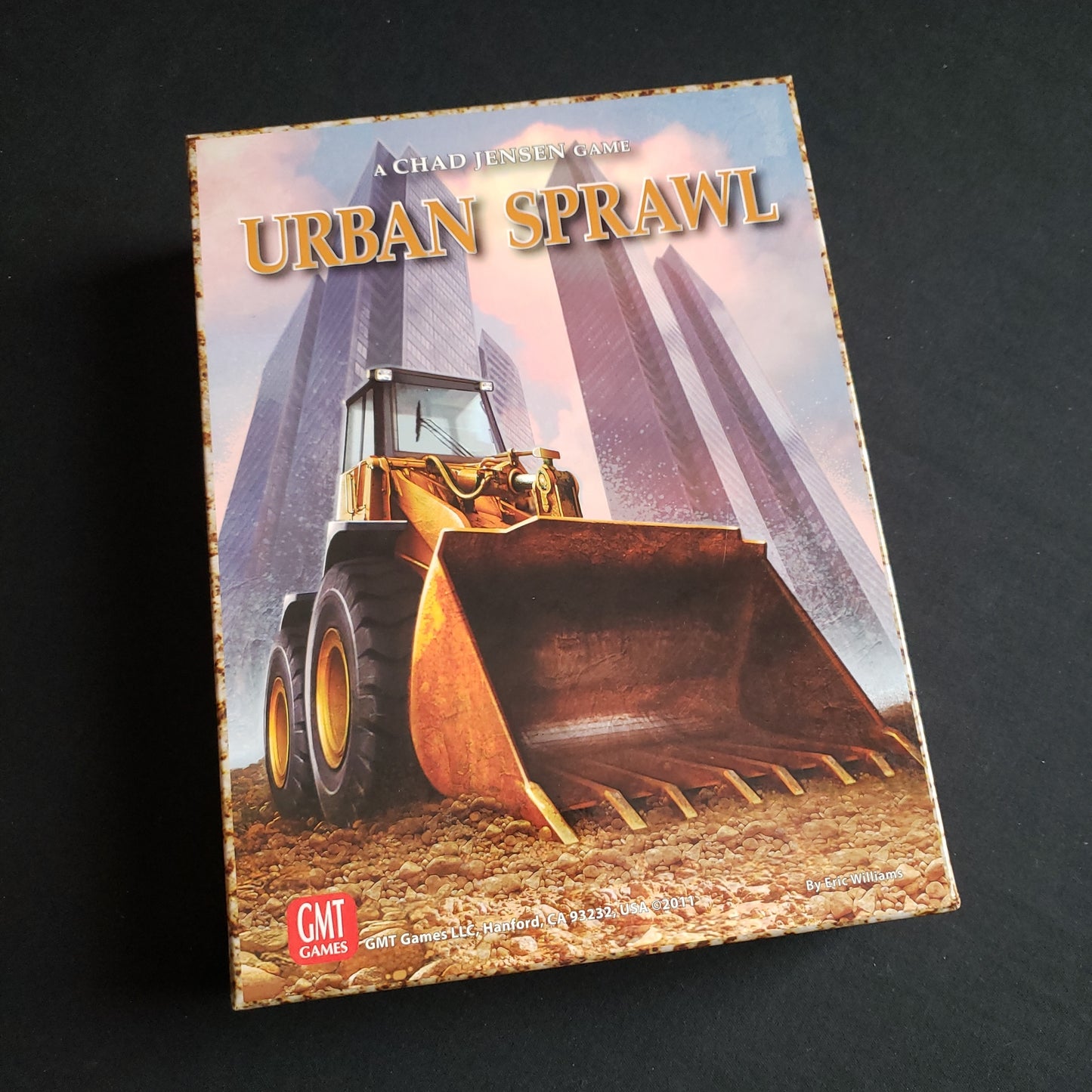 Image shows the front cover of the box of the Urban Sprawl board game