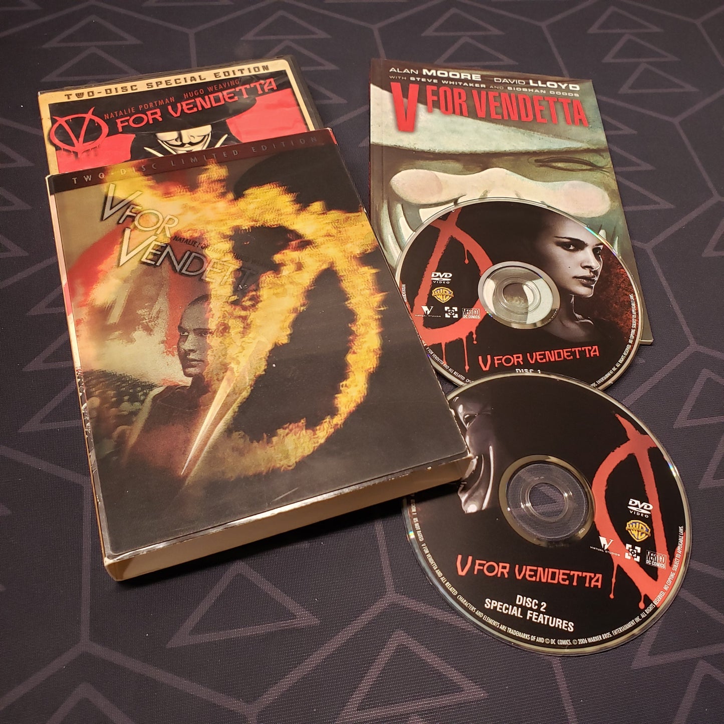 Image shows the case, lenticular sleeve. comic book & two discs for the movie V for Vendetta on DVD