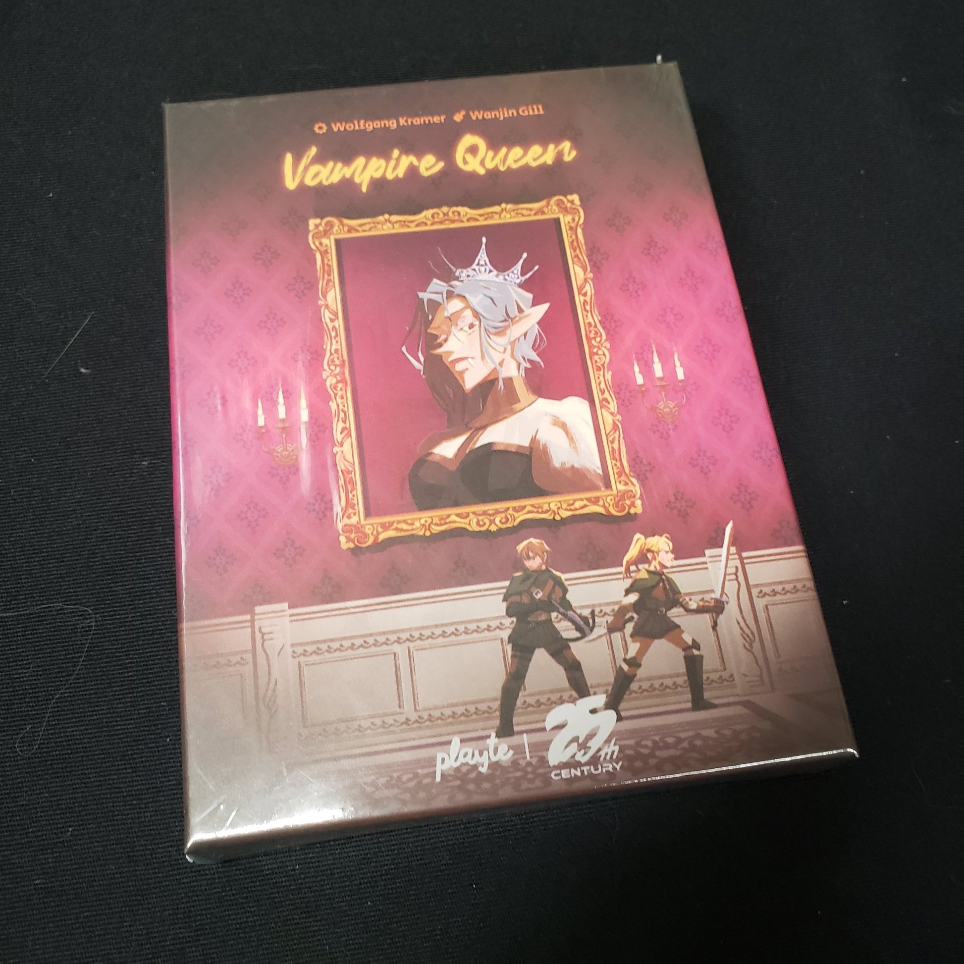 Image shows the front cover of the box of the Vampire Queen card game