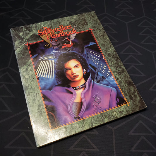 Image shows the front cover of the Storyteller's Handbook for the roleplaying game Vampire: The Masquerade