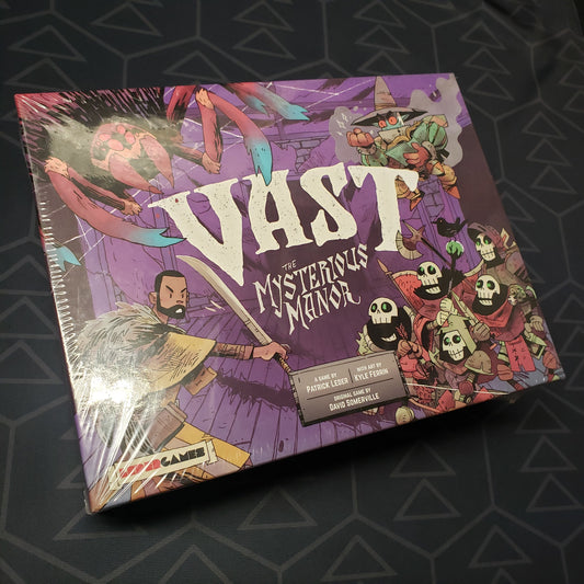 Image shows the front cover of the box of the board game Vast: The Mysterious Manor