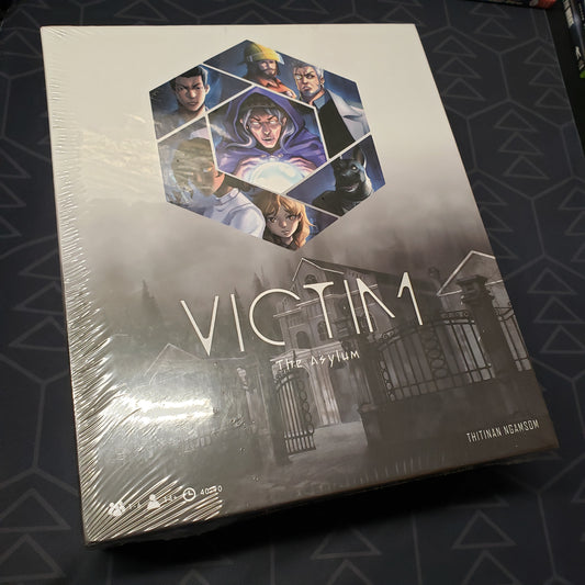 Image shows the front cover of the box of the Asylum expansion for the board game Victim: The Cursed Forest