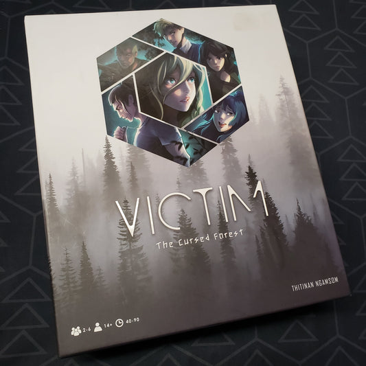 Image shows the front cover of the box for the board game Victim: The Cursed Forest