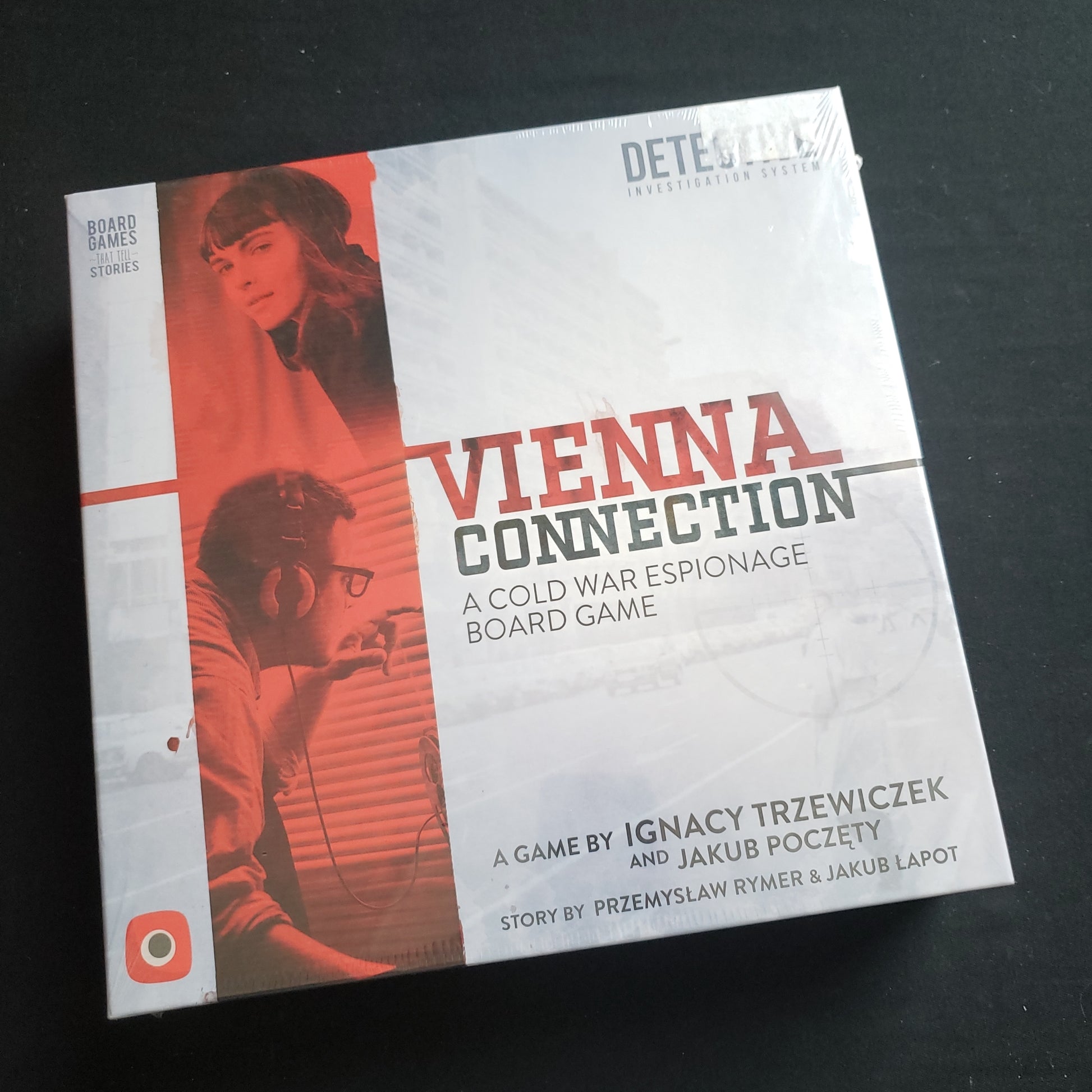 Image shows the front cover of the box of the Vienna Connection board game