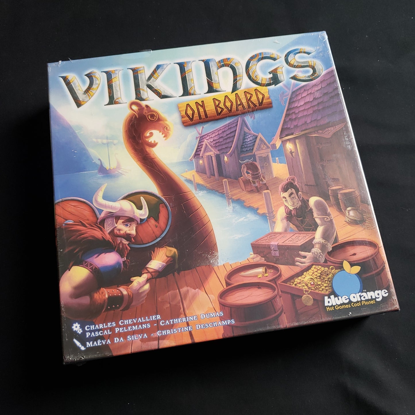 Image shows the front cover of the box of the Vikings On Board board game