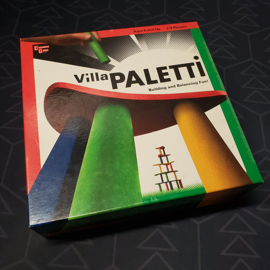 Image shows the front cover of the box for the Villa Paletti board game