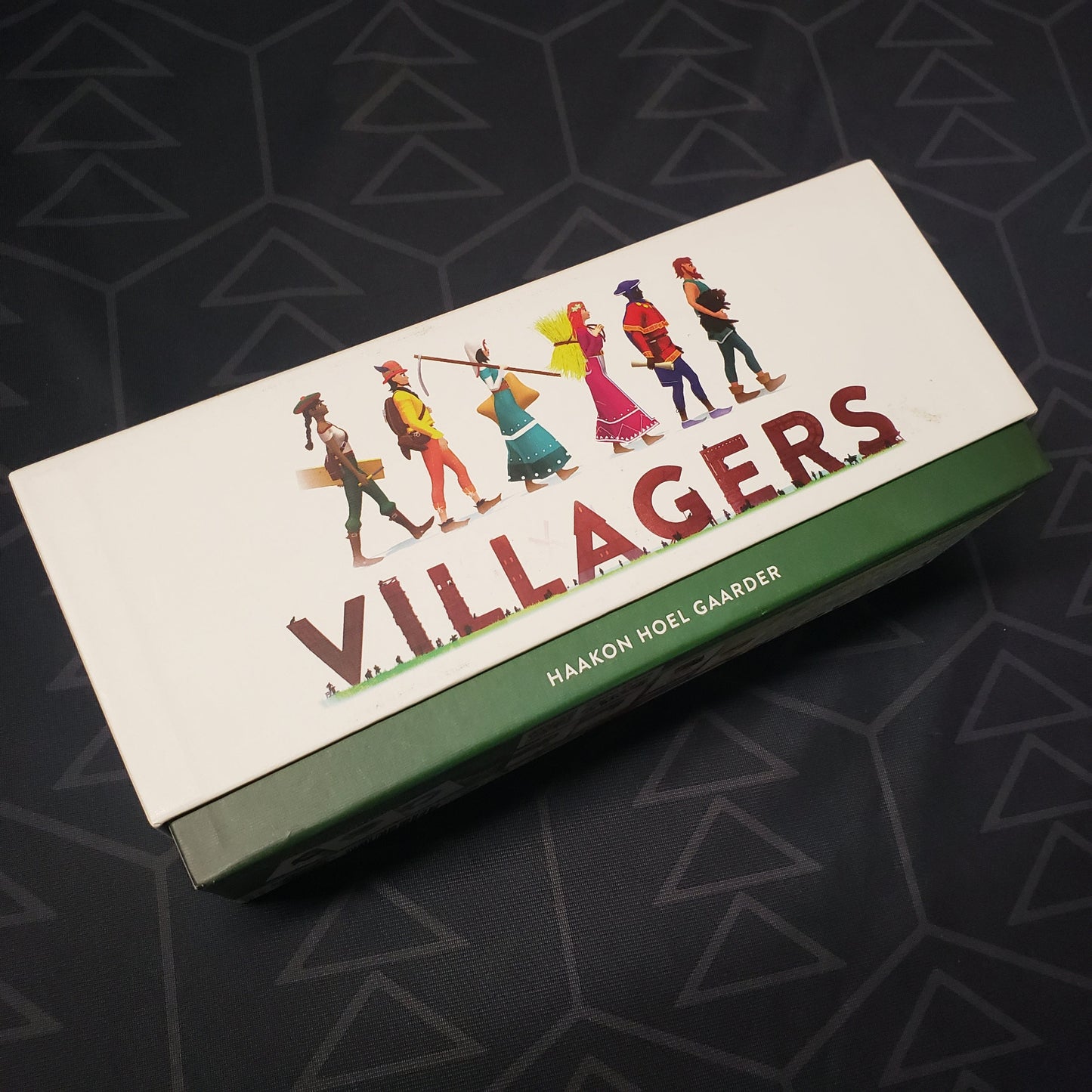 Image shows the front cover of the box for the Villagers card game