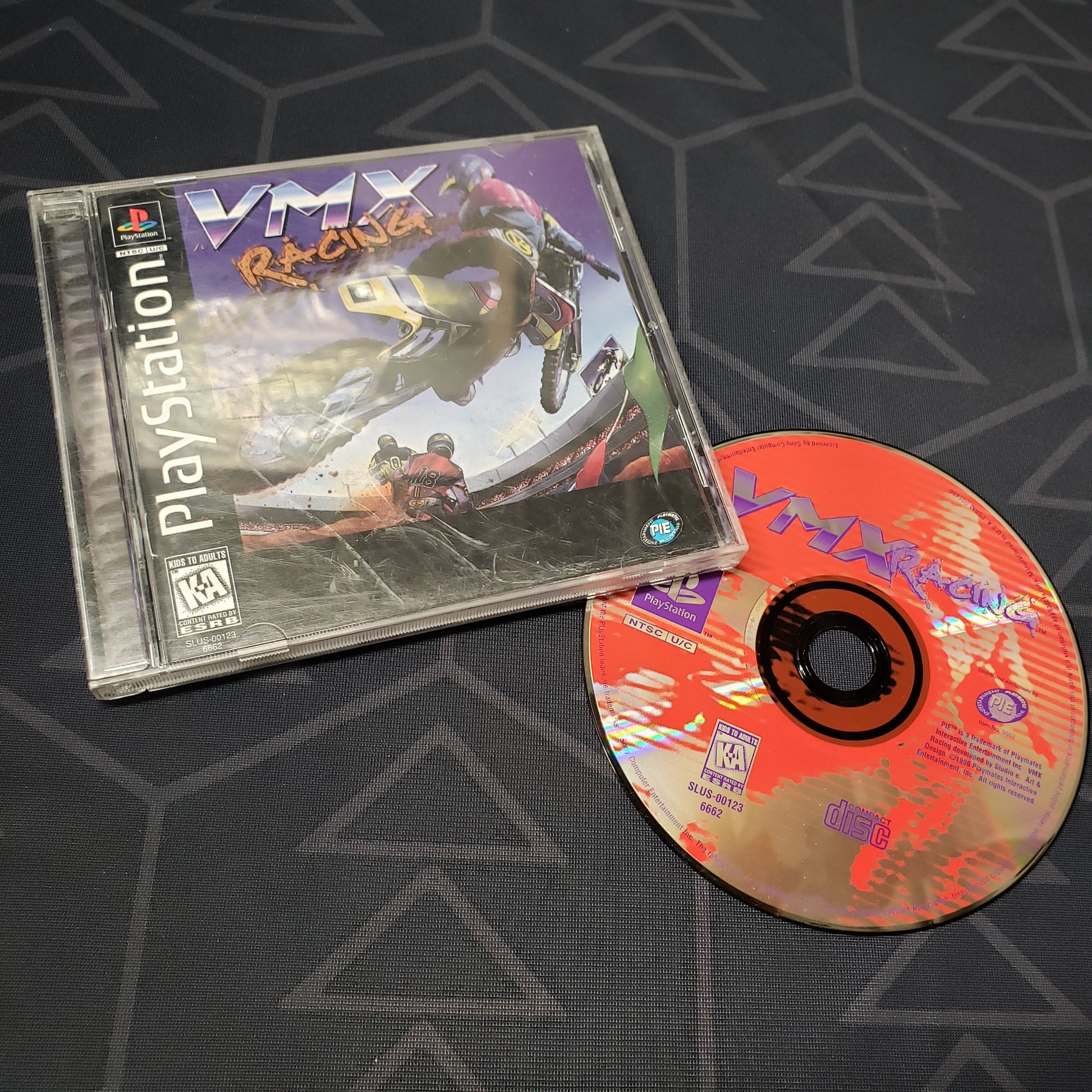 Image shows the jewel case with manual and disc for the video game VMX Racing for Playstation 1