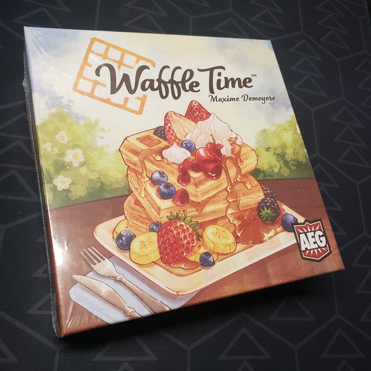Image shows the front cover of the box for the Waffle Time board game