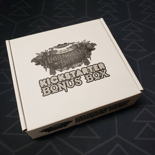 Image shows the front cover of the box of the Kickstarter Bonus Box expansion for the board game Wander: The Cult of Barnacle Bay