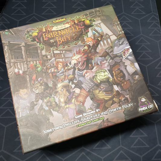 Image shows the front cover of the box for the Wander: The Cult of Barnacle Bay board game