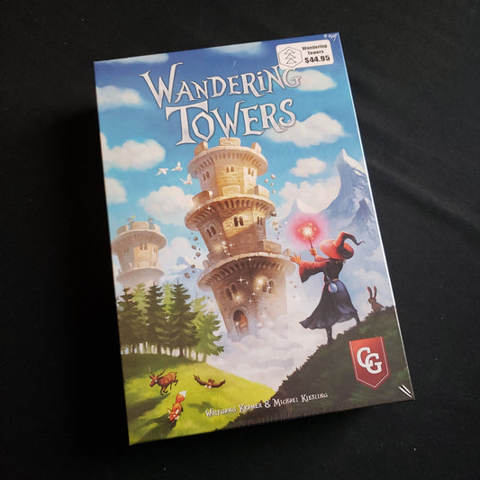 Image shows the front cover of the box of the Wandering Towers board game