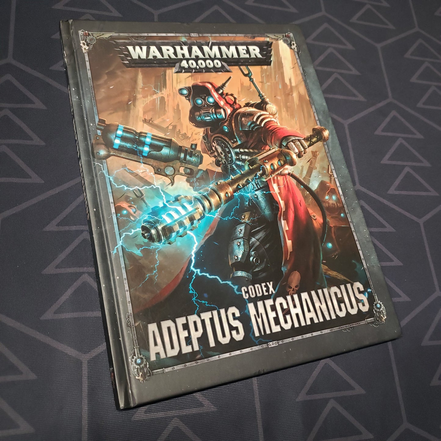 Image shows the front cover of the Warhammer 40,000 (Eighth Edition) Codex: Adeptus Mechanicus wargaming book